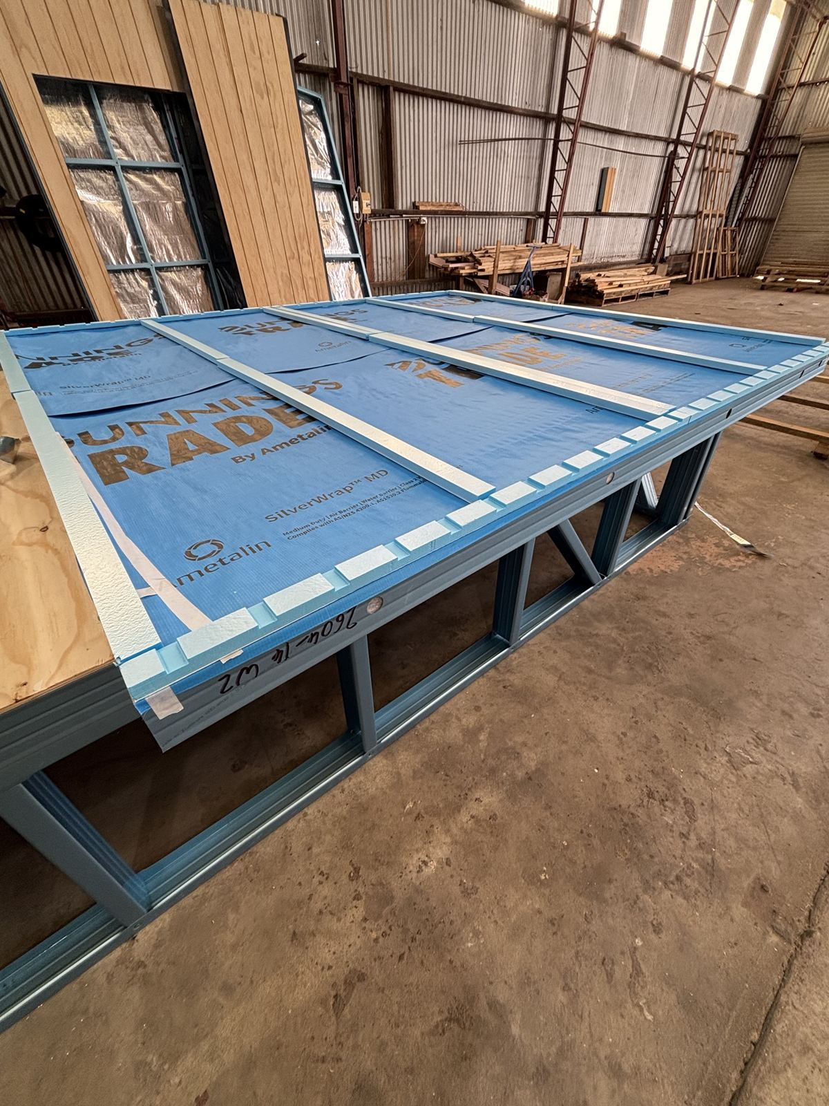 Wall wrap and cavity battens on a panel